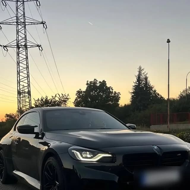 A black BMW G87 M2 at sunset in the Czech Republic